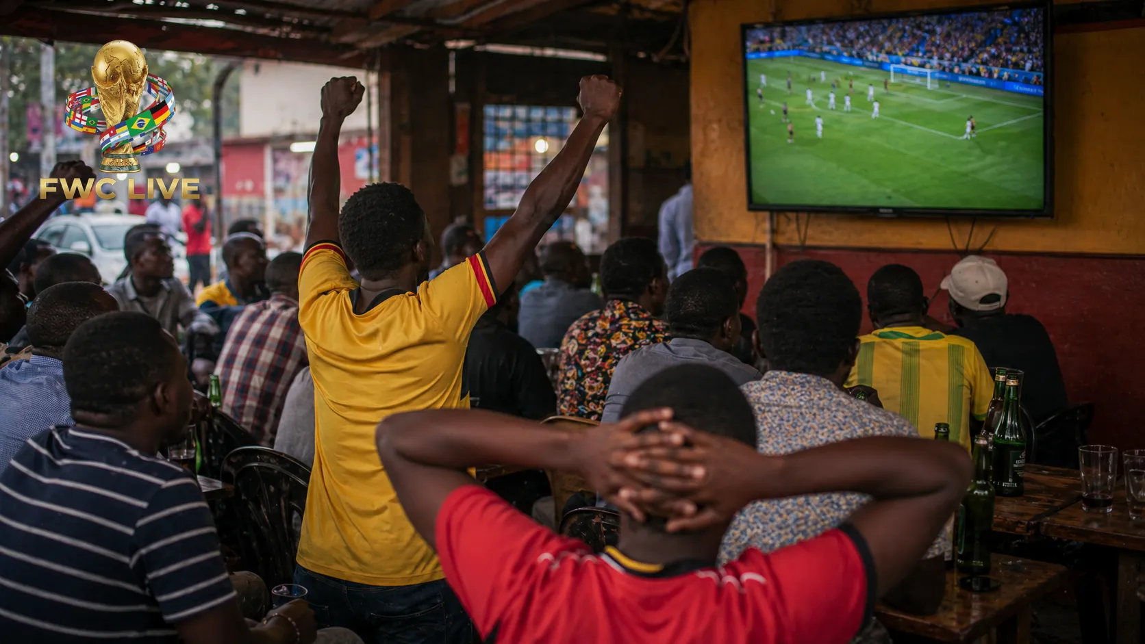 Uganda football fans watching FIFA World Cup 2026 coverage in a Kampala sports cafe